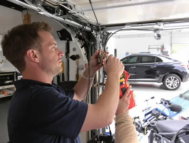 Berlin Garage Door Repair safety certified technician performing cable replacement in Berlin