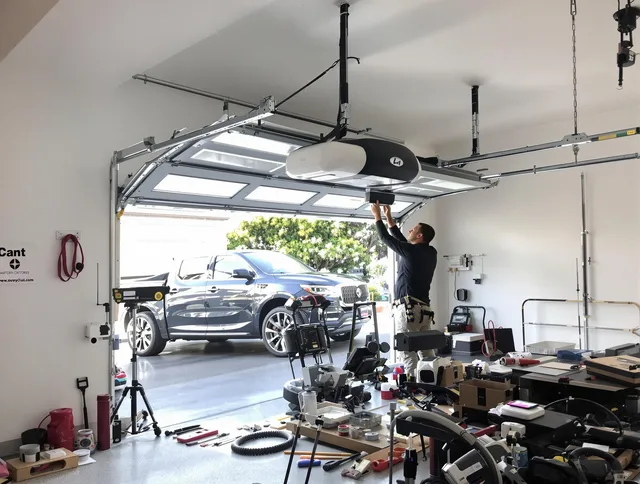 Berlin Garage Door Repair specialist installing smart garage door opener system in Berlin home
